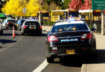Police Say Suspect’s Selfie Blew Open $100,000 Burglary Case Police cars and school buses on a road.