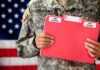 New Election Intel Raises Security Concerns U.S. Army soldier holds a Top Secret folder.