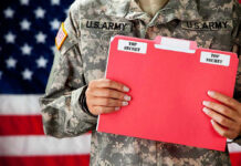 New Election Intel Raises Security Concerns U.S. Army soldier holds a Top Secret folder.