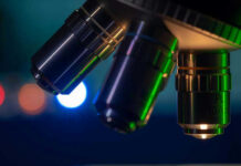 Scientists Uncover the Sleep Switch That Repairs Your Body Closeup of microscope lenses with colorful background