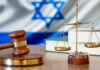 Federal Judge Grants Emergency Relief to Transgender Airman Gavel and scales of justice with Israeli flag in background