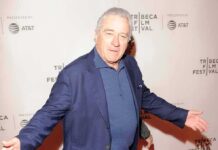 Hundreds of Thousands of Tribeca Records Left Open man in blue blazer posing at a film festival step-and-repeat