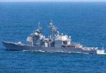 After Nine Nights of Strikes, Concerns Build Over a Prolonged U.S.–Iran War Gray naval warship cruising on open sea