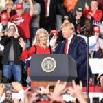 Trump Targets TV Networks About Election Blackout political rally with two speakers at a podium