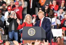 Trump Targets TV Networks About Election Blackout political rally with two speakers at a podium