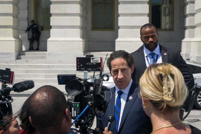 Man in suit speaks to reporters outside a government building