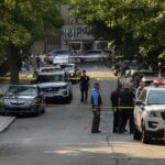 Upper East Side Co-Op Stabbing Leaves Woman Hospitalized Police officers secure a residential street with patrol cars and yellow tape