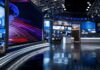 Silence On Cause: Country Music Loses an Icon modern television news studio with large video screens