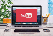 New Site Reveals Police License Plate Searches YouTube logo on a laptop screen on desk.