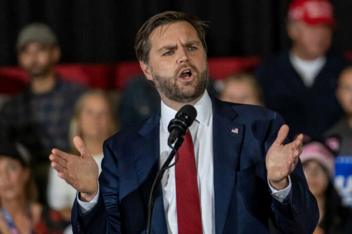 Man in suit speaking at a podium