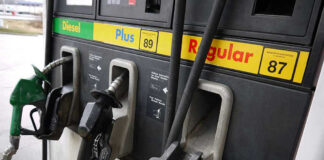 Gas station pumps for diesel, plus, and regular fuel.