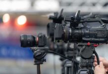 Professional video cameras on tripods