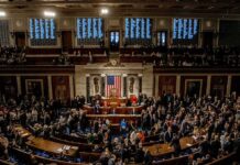 “Threat to Democracy” Rhetoric Intensifies U.S. House chamber with lawmakers gathered before a session