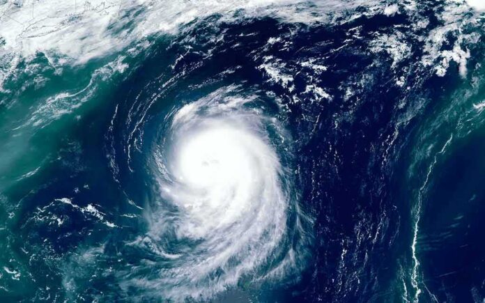 shutterstock_1493291597-1 Satellite view of a powerful hurricane swirling over the ocean
