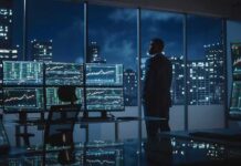 Wall Street Turns on AI’s Rising Star Trader in a dark office with multiple stock monitors and city skyline at night