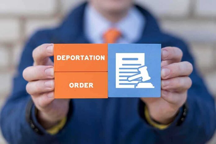 shutterstock_2286917827 Hands holding blocks showing deportation order and legal document icon
