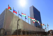 Iran Defends Its Actions at UN United Nations headquarters with member flags under bright sun