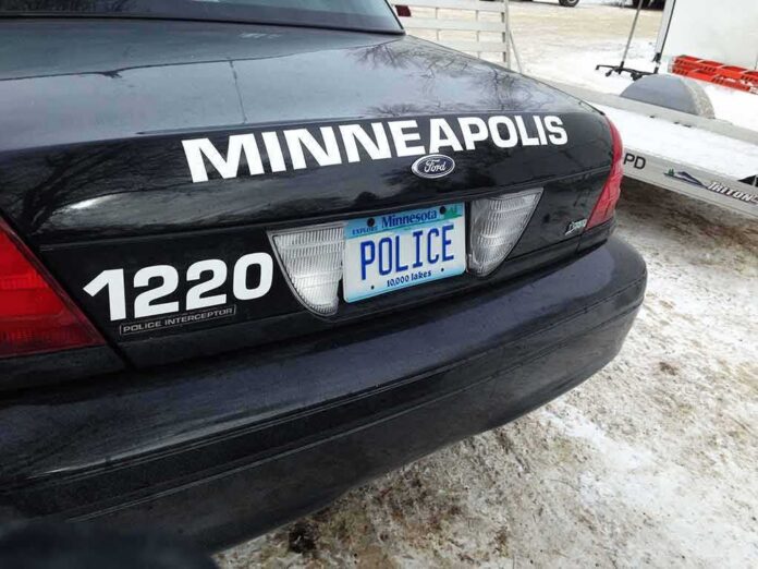 shutterstock_1050870305-1 Rear of Minneapolis police car with Minnesota license plate