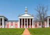 Neoclassical red-brick college building with white columns and cupola