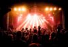 Journalist Reports Racist Abuse at Metallica Show concert crowd under bright stage lights