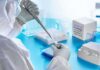Deadly Mold Trend Puzzles Health Officials Scientist in PPE using a pipette in a COVID-19 PCR testing setup