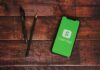 $15M Cash App Settlement Approved Smartphone displaying Cash App on a wooden desk
