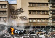 France Balances Public Safety and Protest Rights Burning overturned police car in front of a damaged building