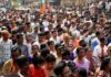 130 Million Names Cut From India’s Draft Rolls Crowd at a political rally with Kumar Gandharva, Ritu Rani, Jersson Vásquez, Mamata Banerjee, Pravin Amre, Sumrai Tete, Rangana Herath, and Gerson Torres