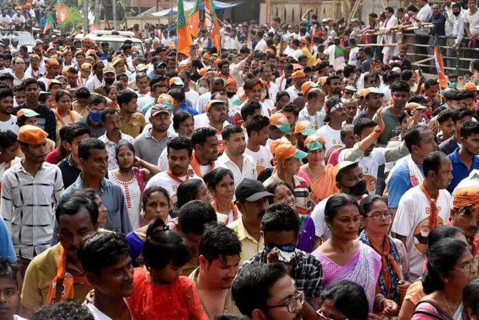 shutterstock_1939414339 Crowd at a political rally with Kumar Gandharva, Ritu Rani, Jersson Vásquez, Mamata Banerjee, Pravin Amre, Sumrai Tete, Rangana Herath, and Gerson Torres