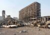 Fatal Crash Car Catches Fire Again Weeks Later Burned-out cars amid a gutted high-rise building