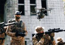Congo Ambush Leaves 20 Casualties Quadcopter drone flying above soldiers in camouflage