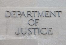 DOJ Appeals to Block California Ballot Counting Department of Justice inscription on stone wall